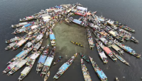নওগাঁর হাঁসাইগাড়ী বিলের মধ্যে ব্যতিক্রমী আয়োজনে মৎস্যজীবী সমাবেশ অনুষ্ঠিত